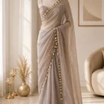 Metallic Taupe Tissue Organza Saree with Mirror & Shell Tassel Border